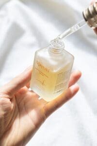 Closeup view of a person holding serum bottle